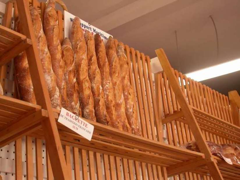 baguettes on display rack in shop